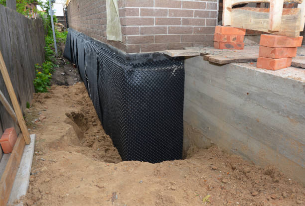 SJ Waterproofing Pros technician performing targeted Interior Drainage System assessment in Remus, MI